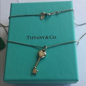 Tiffany & Co silver key pendant with a diamond